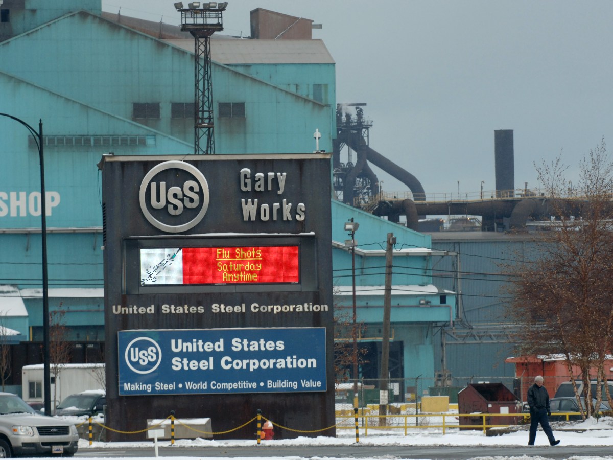A worker walks by a portion of the USS Gary Works plant near downtown Gary, Indiana.
